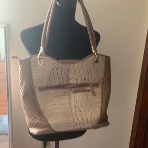 A woman’s large purse lotta compartments,